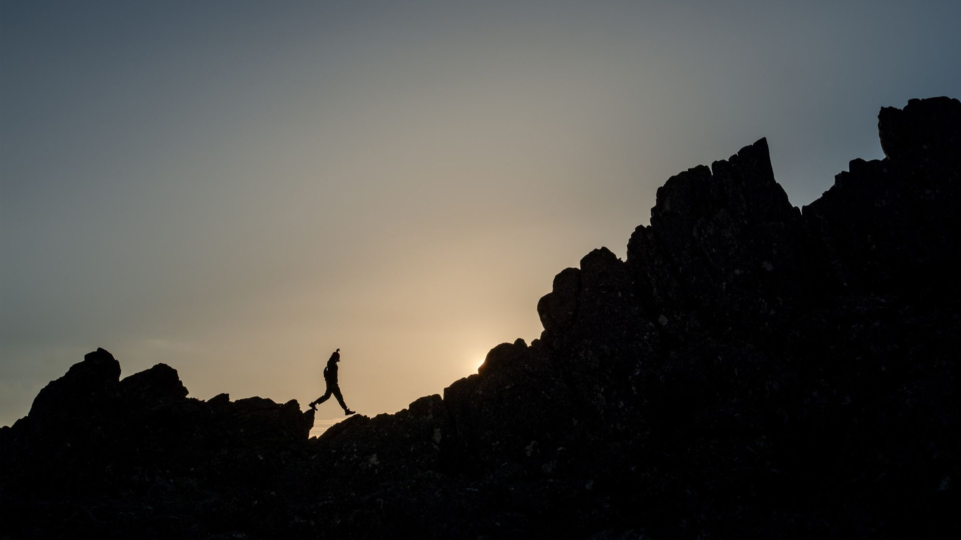 A person climbing a mountain